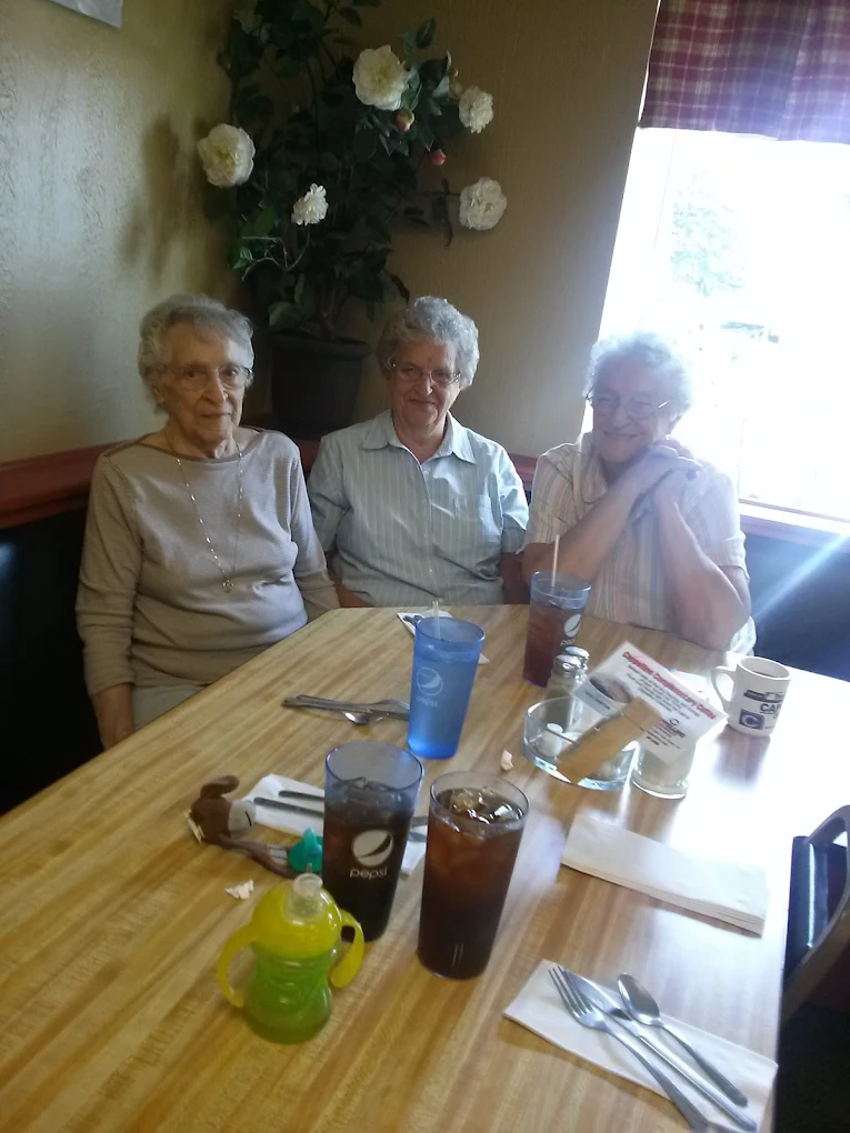 Three generations seated together at Three Girls Cafe