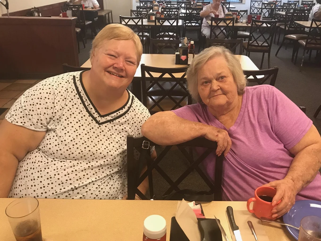 Guests sharing coffee at Three Girls Cafe